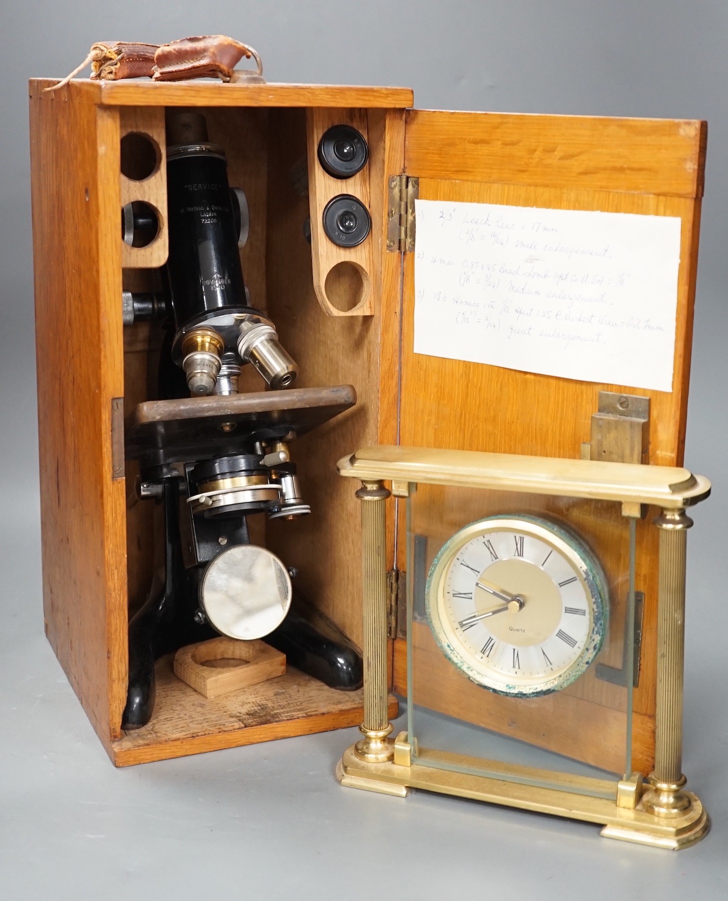 An oak-cased black japanned microscope, case 35cm high, width 16cm, 20cm depth and a brass mantel timepiece
